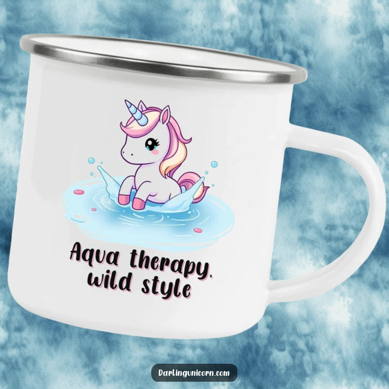 Funny camping mug showing a unicorn playfully splashing in a crystal clear pond during outdoor excursions.
