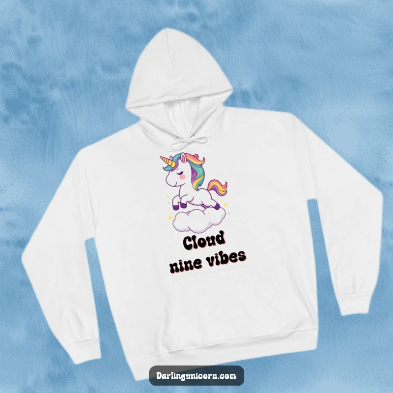 Funny hoodie featuring a cute unicorn with a rainbow mane joyfully leaping over a sparkling cloud, perfect for cozy, magical days.