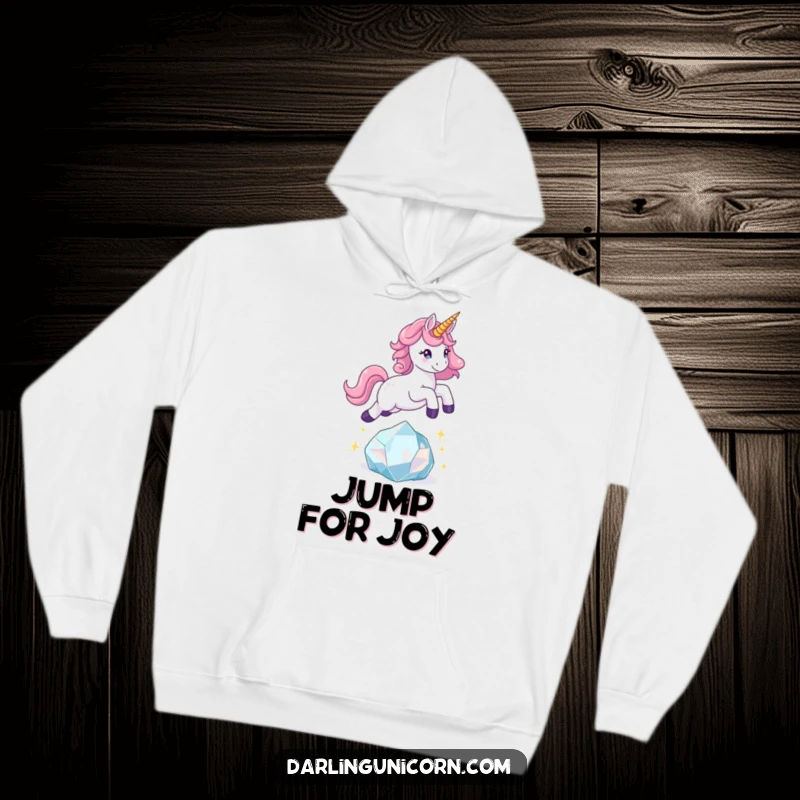 Funny unicorn hoodie showing a playful unicorn leaping over a sparkling crystal, radiating fun and magical energy.