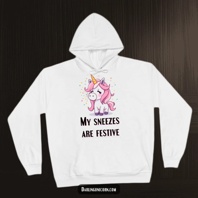 Funny surprised unicorn sneezing a rainbow of confetti, printed on a warm and snuggly hoodie.