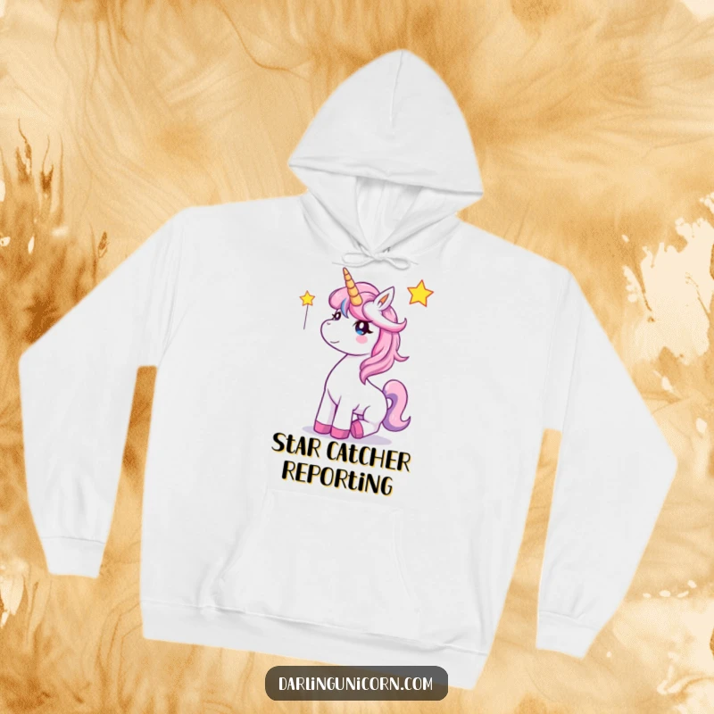 Funny Unicorn Hoodie: A happy unicorn catches a falling star, radiating warmth and magical delight.