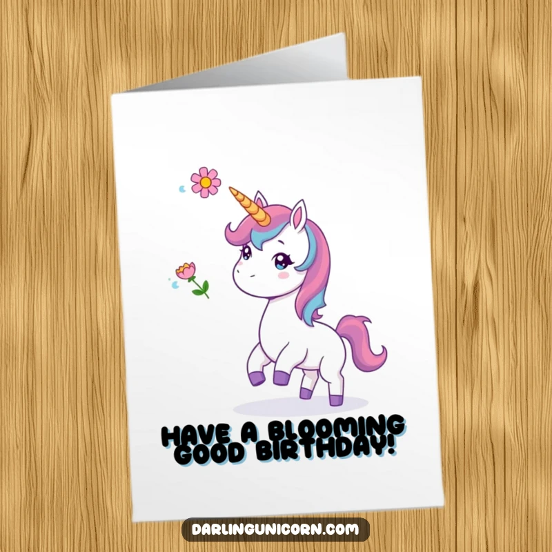 Funny Free Printable Birthday Card: A cheerful unicorn playfully tosses a delicate flower high into the air.