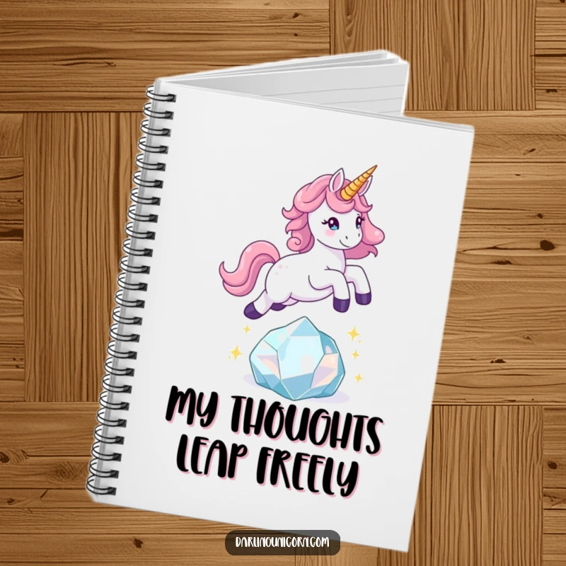 Funny unicorn notebook with a playful unicorn leaping over a sparkling crystal, ideal for capturing energetic thoughts.