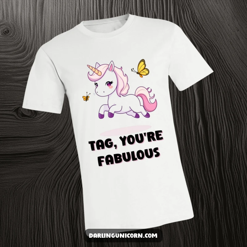 Funny t-shirt illustrating an ecstatic unicorn leaping joyfully while playing tag with a cheeky butterfly, embodying pure, active fun.