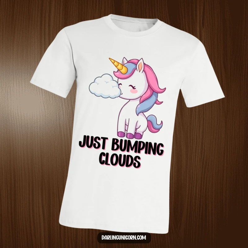 Funny unicorn t-shirt illustrating a unicorn gently nudging a fluffy cloud with its nose, embodying playful wonder.