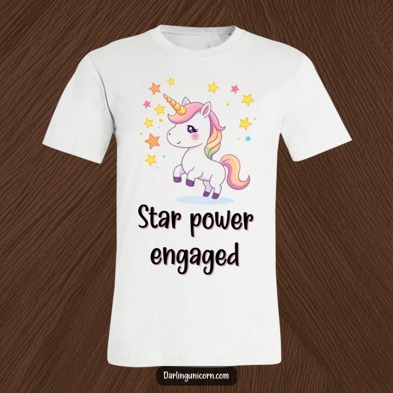Funny t-shirt of a unicorn expertly juggling colorful star fragments using its horn, projecting an image of skill and playful magic.
