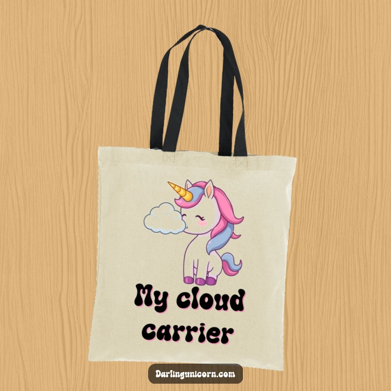 Funny unicorn tote bag showing a unicorn gently bumping a floating cloud with its nose in a playful manner.